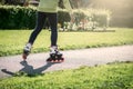 Teenage girl is skating on roller blades in the park Royalty Free Stock Photo