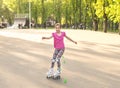 Teenage girl skating wearing knee protection Royalty Free Stock Photo