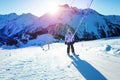 Teenage girl on the ski drag lift rope over sunset Royalty Free Stock Photo