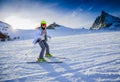 Teenage girl skiing in Swiss Alps.