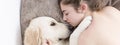 Teenage girl sleeping with her dog. Royalty Free Stock Photo