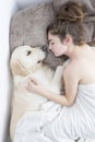 Teenage girl sleeping with her dog. Royalty Free Stock Photo