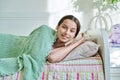 Teenage girl sleeping at home in bed, calm teenager looking at camera Royalty Free Stock Photo