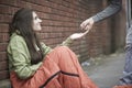 Teenage Girl Sleeping On The Street Being Given Money