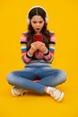 Teenage girl with smart phone. Portrait of teen child using mobile phone, cell web app. Shocked amazed face, surprised Royalty Free Stock Photo