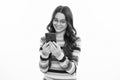 Teenage girl with smart phone. Portrait of teen child using mobile phone, cell web app. Happy girl face, positive and Royalty Free Stock Photo