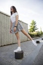 Teenage girl standing on a step with her leg balanced
