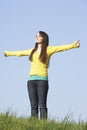 Teenage Girl Standing in Summer Meadow Royalty Free Stock Photo