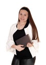Teenage girl standing white jacket holding a book in hands Royalty Free Stock Photo