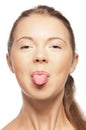 Teenage girl sticking out her tongue Royalty Free Stock Photo