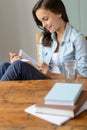 Teenage girl student reading book at home Royalty Free Stock Photo