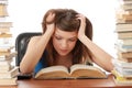 Teenage girl studying at the desk being tired Royalty Free Stock Photo