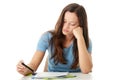 Teenage girl studying at the desk being tired Royalty Free Stock Photo