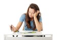 Teenage girl studying at the desk being tired Royalty Free Stock Photo