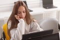 Teenage girl studying on her computer Royalty Free Stock Photo