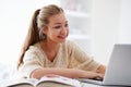 Teenage Girl Studying On Laptop At Home Royalty Free Stock Photo