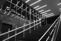 Teenage girl on subway stairs, with interior lights reflecting and Belgrade department store sign the night