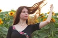 A teenage girl in sunflower fileld
