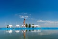 Teenage girl in swimsuit goes along pool background sky Royalty Free Stock Photo