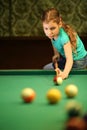 Teenage girl takes aim at a Royalty Free Stock Photo