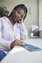 Teenage Girl Taking A Break From Social Media After Abuse And Bullying Laying Mobile Phone Down On Table Royalty Free Stock Photo