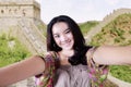 Teenage girl taking photo at Great Wall Royalty Free Stock Photo