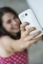 Teenage girl taking a selfie with her phone Royalty Free Stock Photo