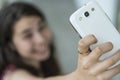 Teenage girl taking a selfie with her phone Royalty Free Stock Photo