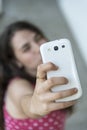 Teenage girl taking a selfie with her phone Royalty Free Stock Photo