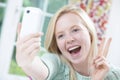 Teenage Girl Taking Selfie On Mobile Phone Royalty Free Stock Photo
