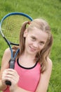 Teenage girl with tennis racket Royalty Free Stock Photo