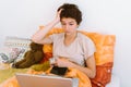 Teenage girl, in bed, lying down, using laptop Royalty Free Stock Photo