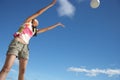 Teenage girl throwing ball