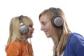 Teenage girl and toddler listen music Royalty Free Stock Photo
