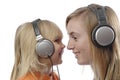 Teenage girl and toddler listen music Royalty Free Stock Photo