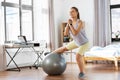 teenage girl training on exercise ball at home Royalty Free Stock Photo