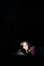 Teenage girl using her cell phone at night Royalty Free Stock Photo