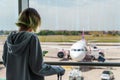 Teenage girl is waiting for her flight Royalty Free Stock Photo