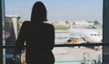 Teenage girl is waiting for her flight Royalty Free Stock Photo