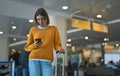 Teenage girl is waiting for her flight Royalty Free Stock Photo