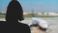 Teenage girl is waiting for her flight Royalty Free Stock Photo