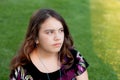 Teenage girl wearing earbuds listening to music Royalty Free Stock Photo