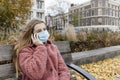 Teenage girl wearing mask calling on phone Royalty Free Stock Photo