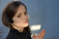 Teenage girl wearing headphones listening to music Royalty Free Stock Photo