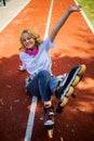 Teenage Girl Wearing Roller Skaters While Standing On The Road In Summe Park.