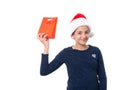 Teenage girl wearing a Santa hat and holding a Christmas present Royalty Free Stock Photo
