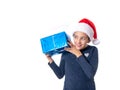 Young girl holding a present and looking excited Royalty Free Stock Photo