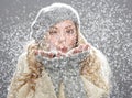 Teenage Girl Wearing Warm Winter Clothes In Studio