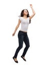 Teenage girl in white blank t-shirt jumping Royalty Free Stock Photo