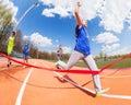 Teenage girl wins race by crossing the finish line Royalty Free Stock Photo